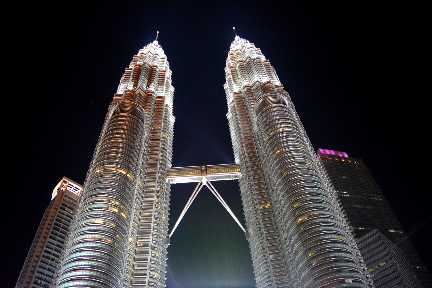 Petronas Twin Towers lit with lights in the evening