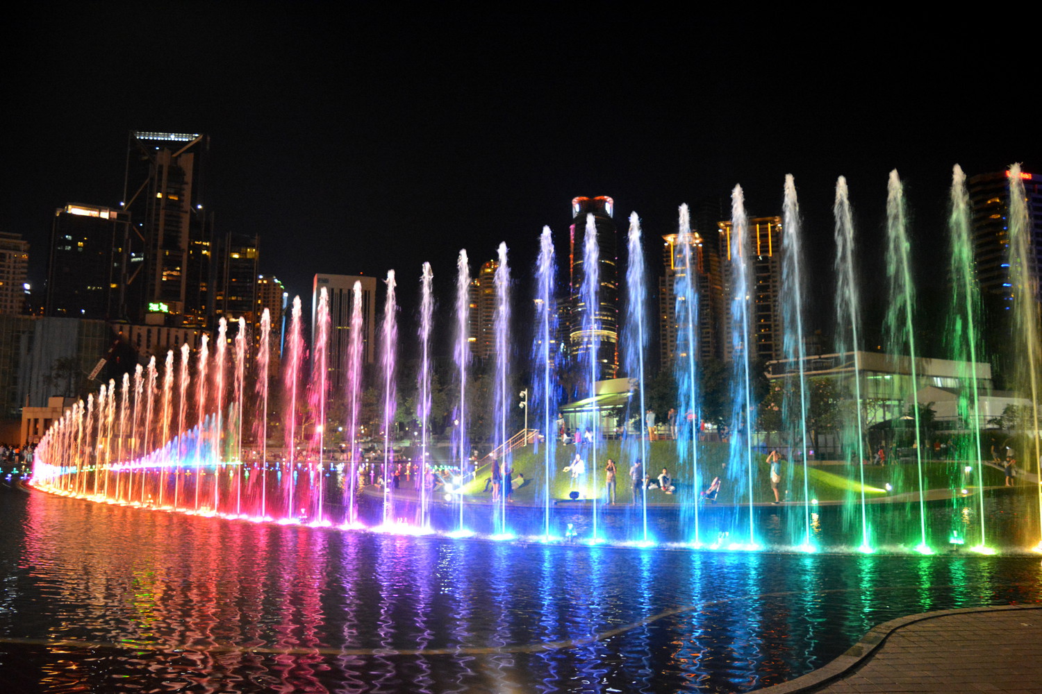 Musical fountain at Simfoni Lake in the evening; the water fountains are lit up by colorful lights